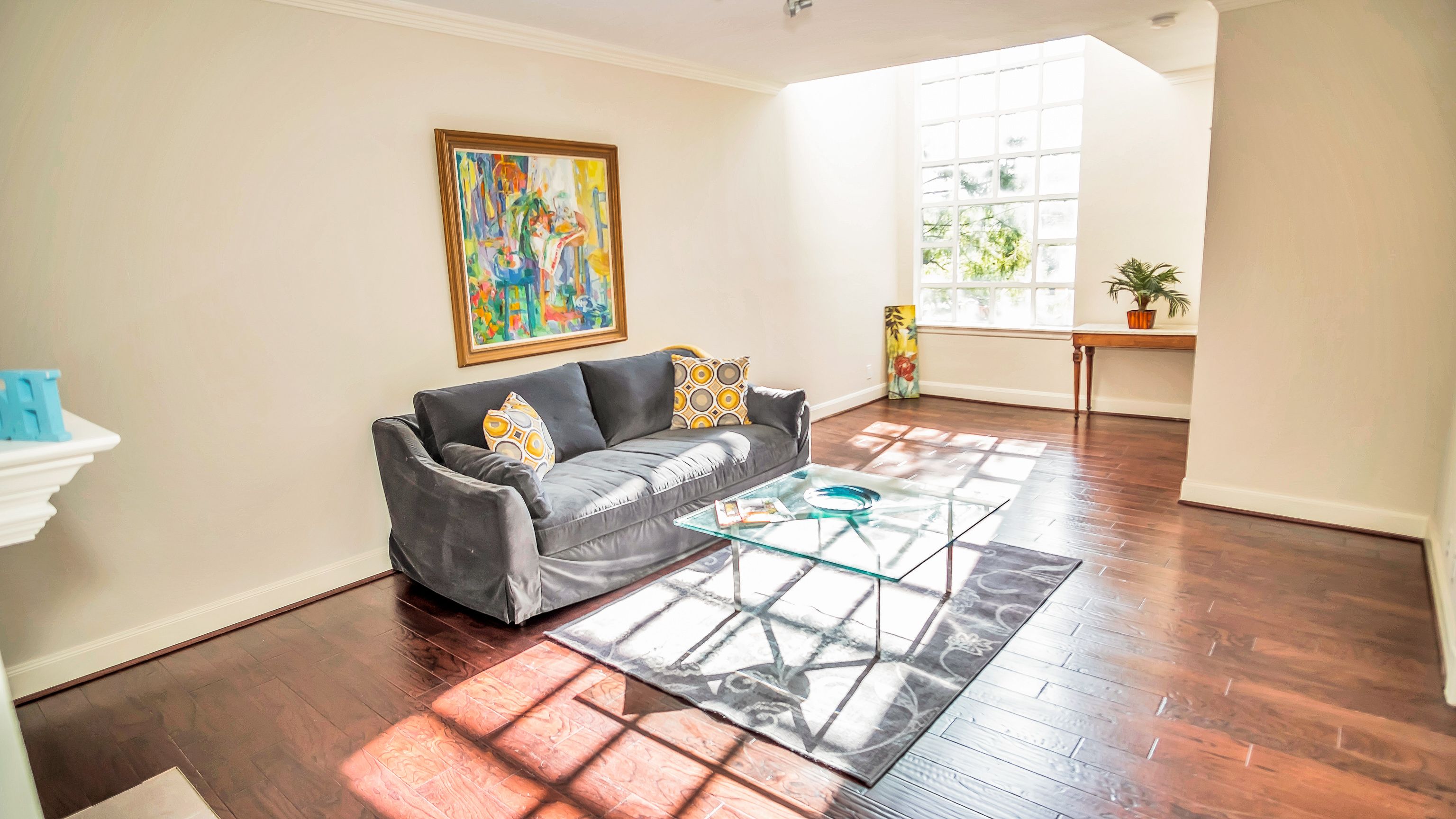 Sun-Filled Living Area with rich walnut flooring Sun-Filled Living Area with rich walnut flooring