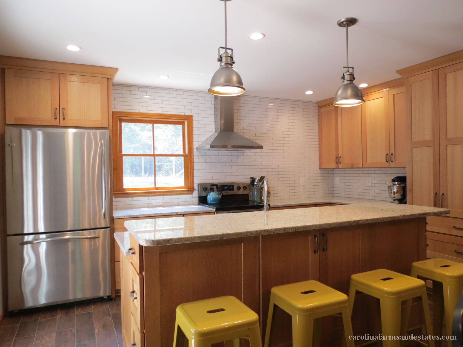 The newly added kitchen with break-fast bar island is ideal for entertaining.