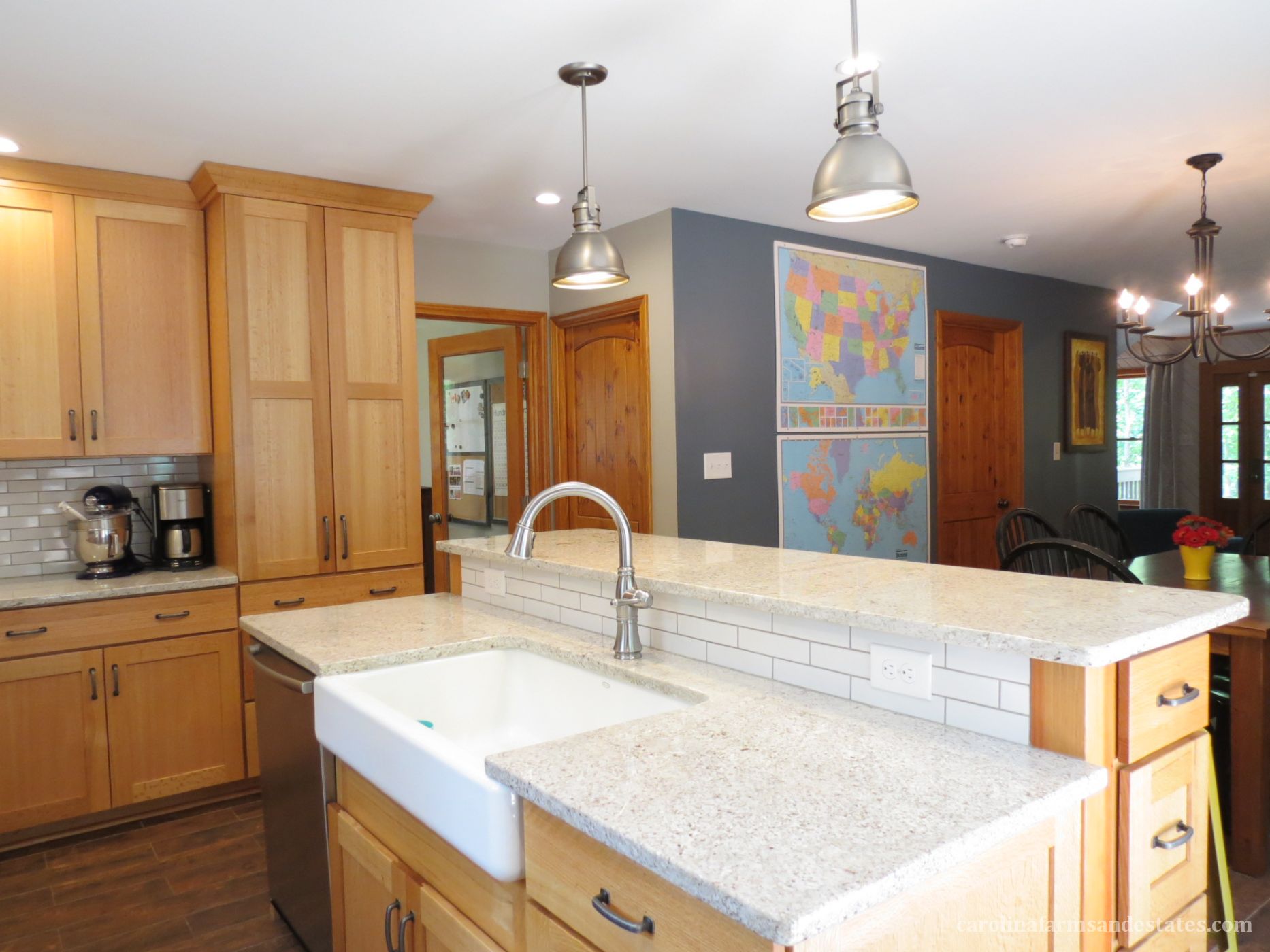 Solid wood custom quarter-sawn Oak cabinets and pantry provide plenty of storage.