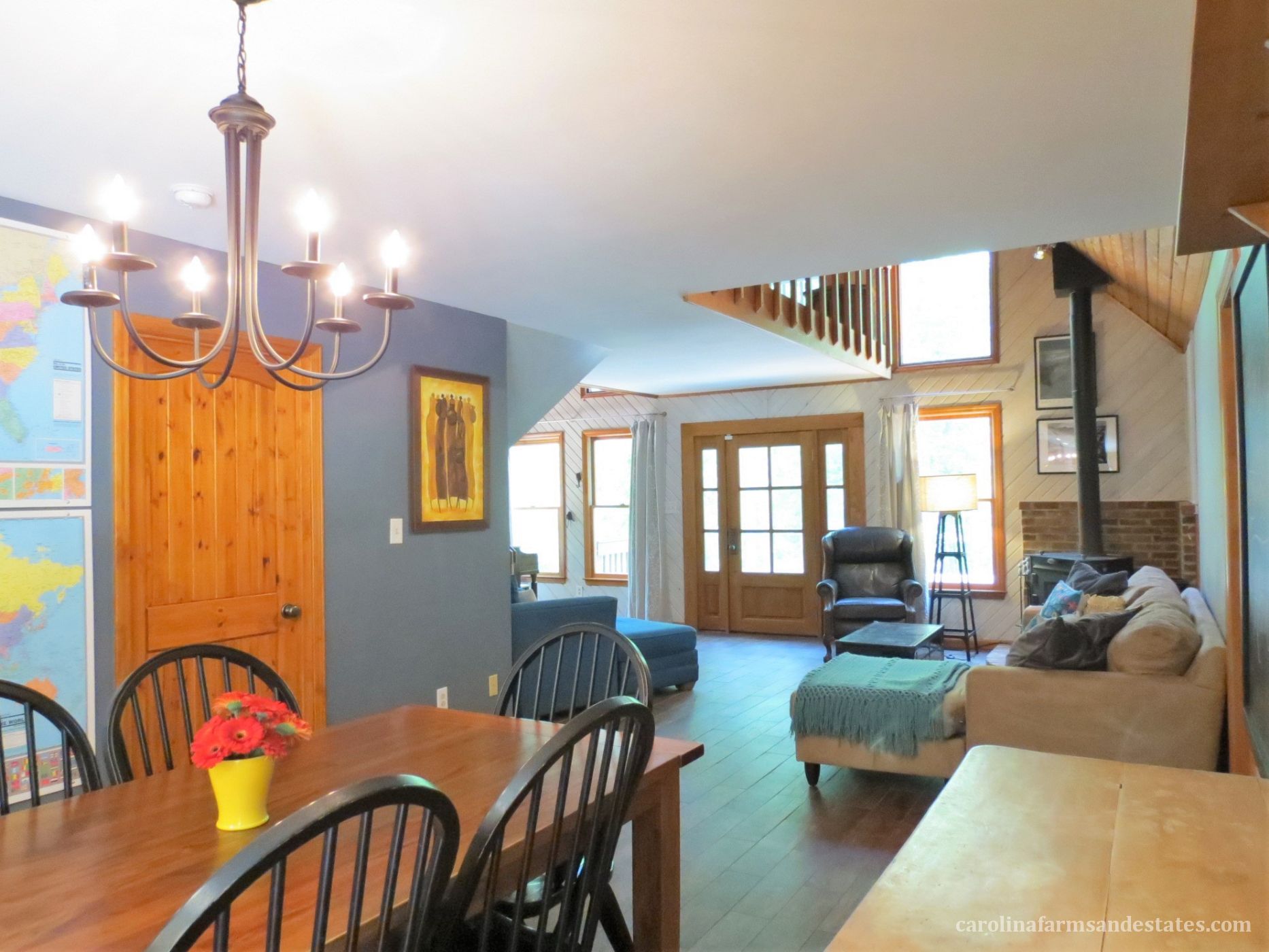 The family room opens up to the dining area. The wood-burning stove adds rustic charm!