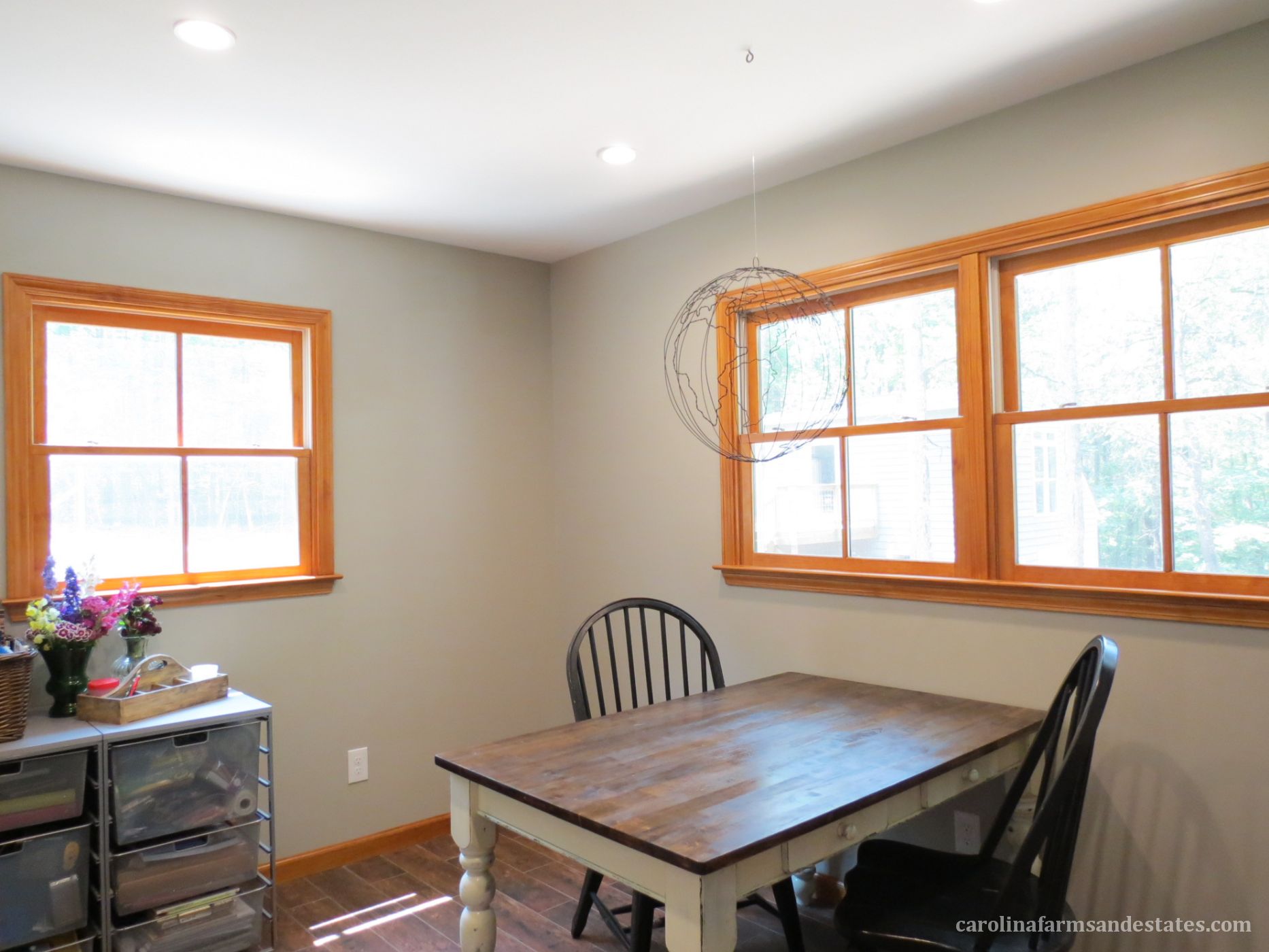 The room located off the kitchen could be den/office/play/craft/guest...room