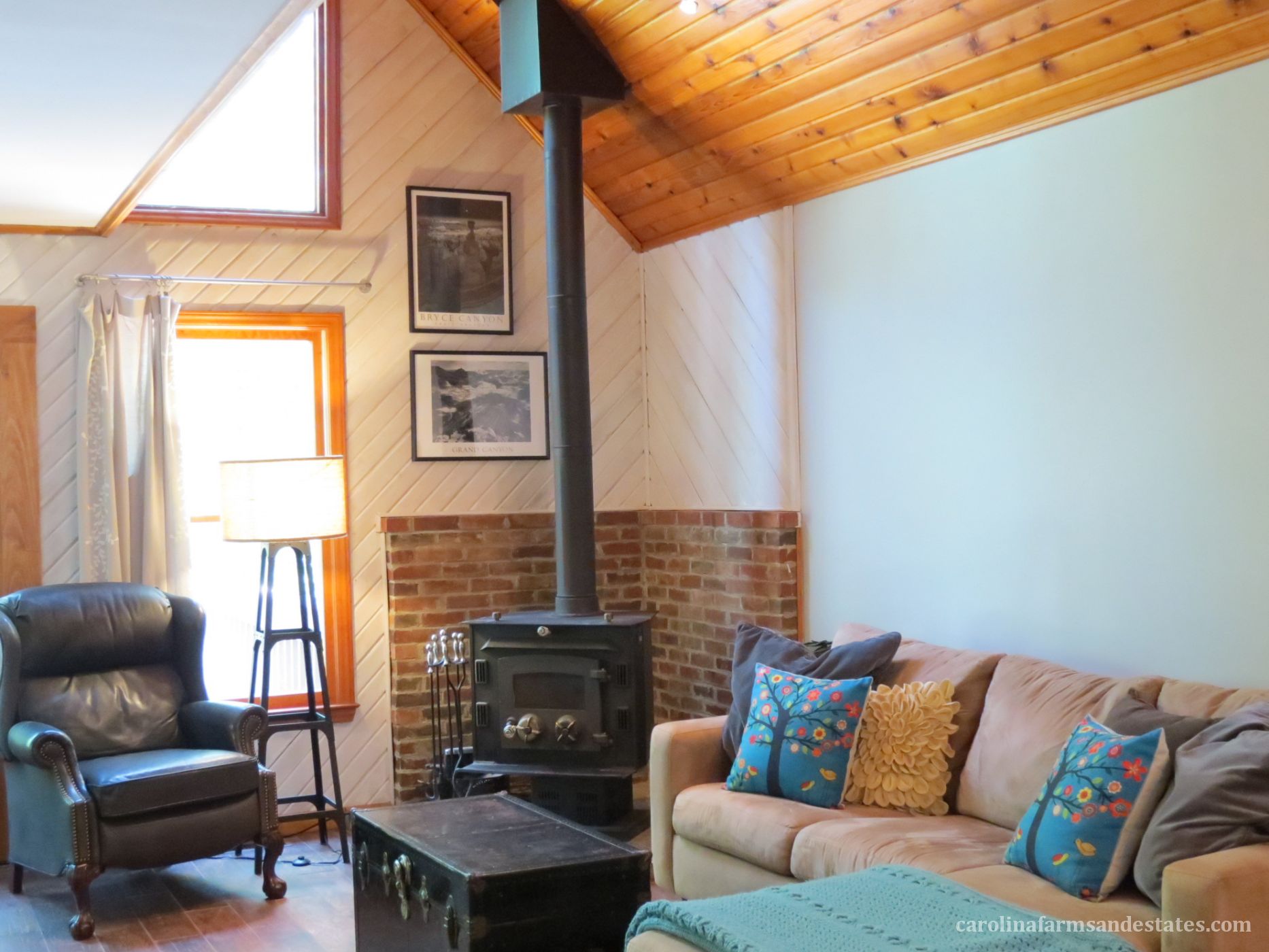 You can't help but notice the beautiful knotty pine tongue and groove vaulted ceiling