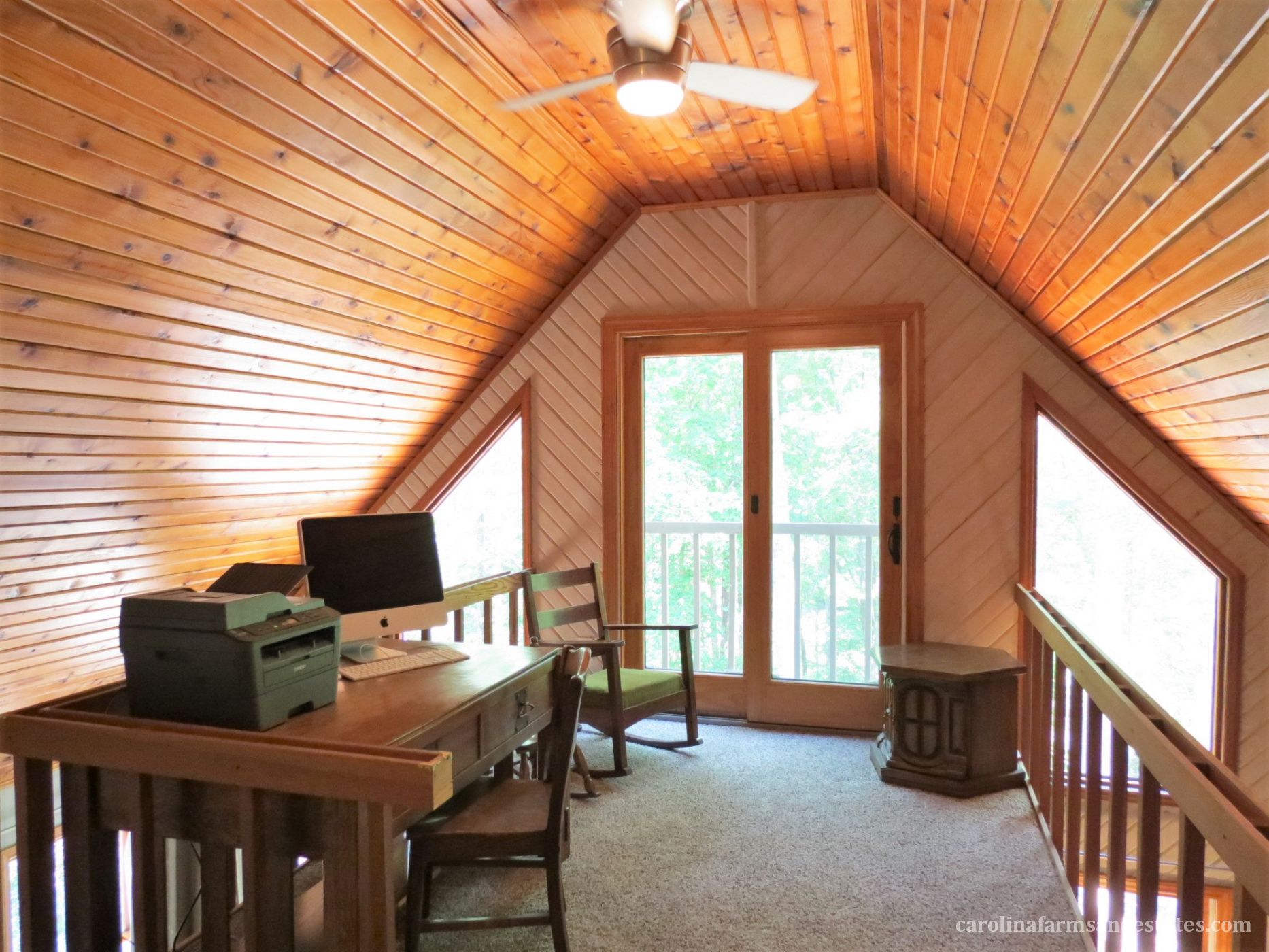 The loft area is ideal for home office or sitting area. Balcony overlooks property.