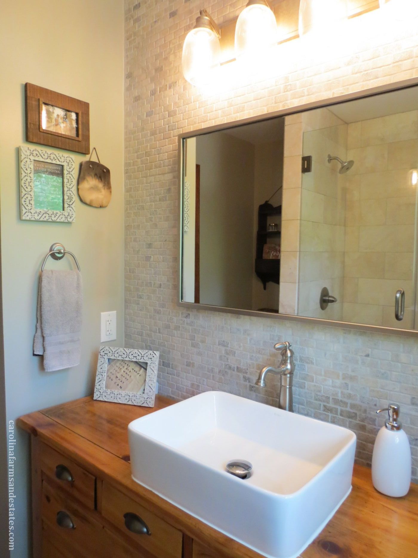 The master bedroom features a custom sink base with farmhouse sink, tiled wall.