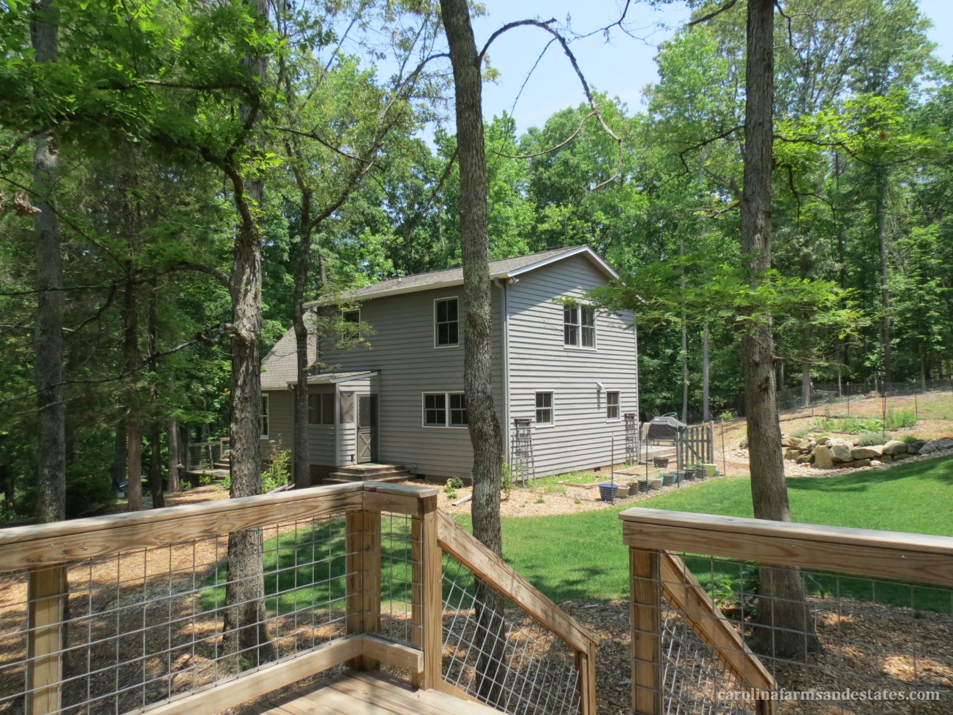 The deck from the newly finished 2nd living quarters overlooks backyard.