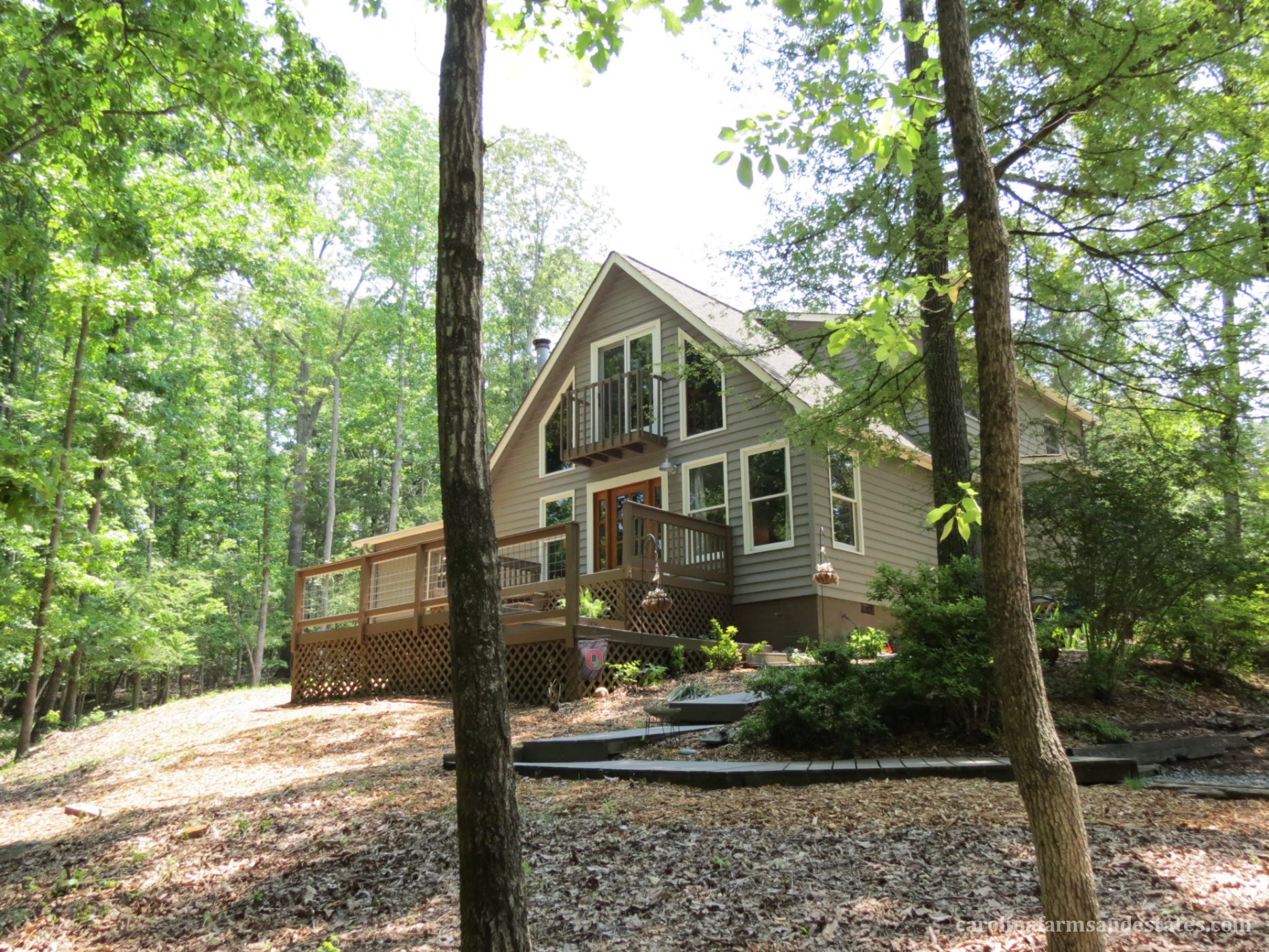 3BR/2.5BA Home nestled high on hill among stately hardwood trees for tons of privacy! 