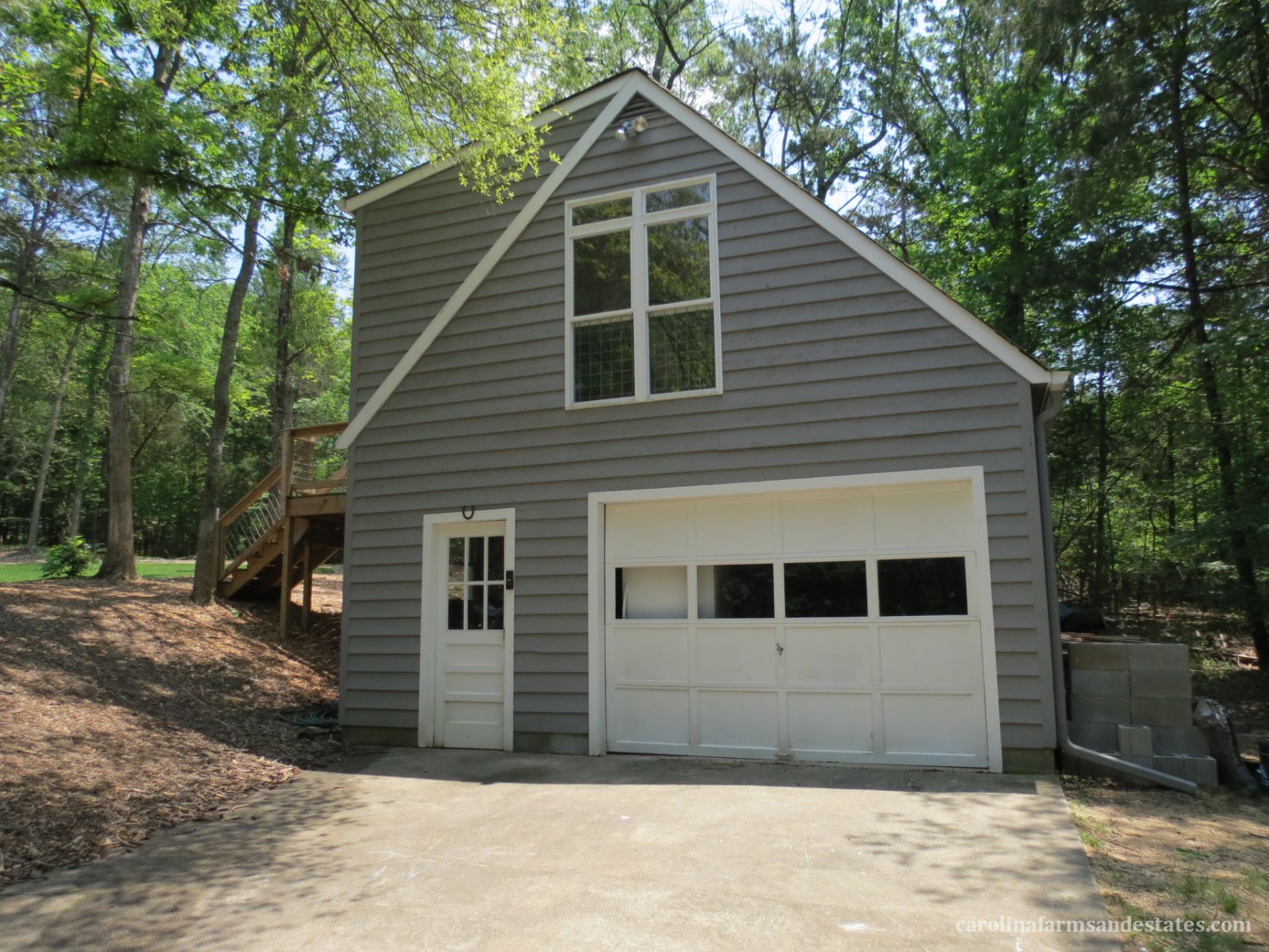 The detached garage has a 2nd living quarters on top w/BR, BA & Kitchenette