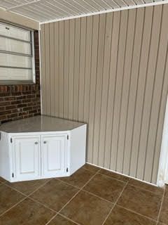TV stand on screened porch
