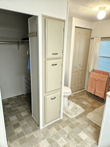 master WI closet, toilet, linen closet master WI closet, toilet, linen closet