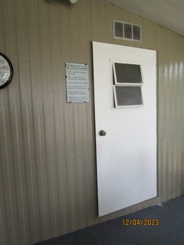 entry door to large storage/utility shed