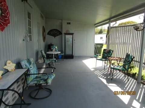 long carport, patio with sun protection
