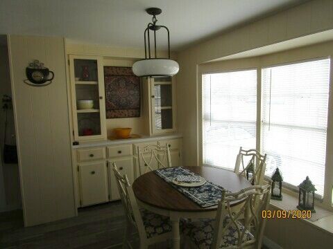 dining area, bay windows, built-in hutch