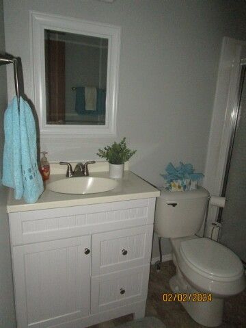 bath newer vanity, commode