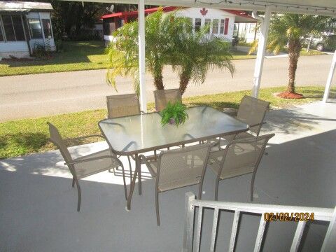 carport patio table/6 chairs