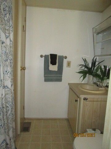 front bath w walk-in shower, linen storage