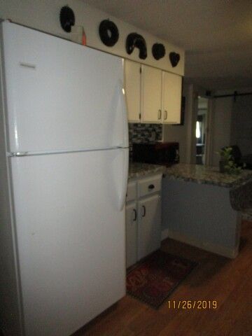 refrigerator, more cabinets, bkfst counter