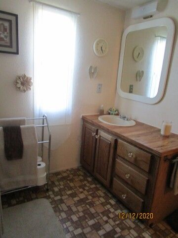 view of vanity in rear bath