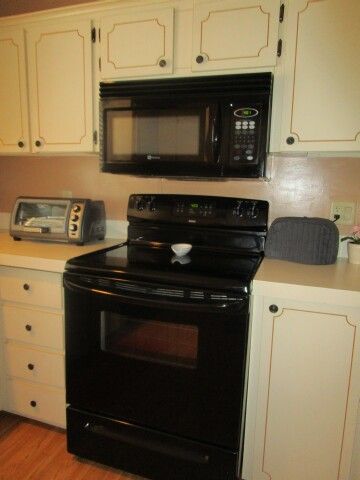 close up of microwave, flat top range