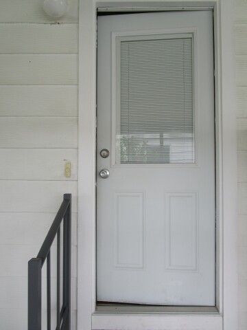 carport entry door to indoor laundry