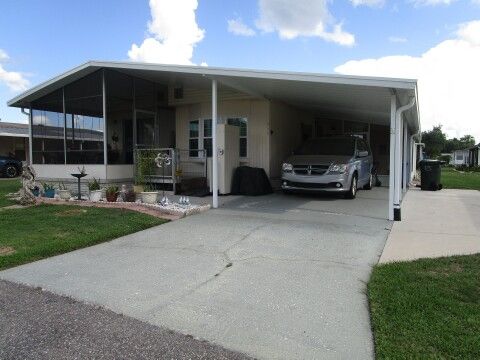 carport view with extra side slab