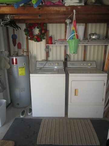 utility shed, water heater, washer/dryer