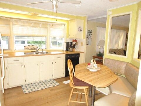 sink area, bow window, seating/storage