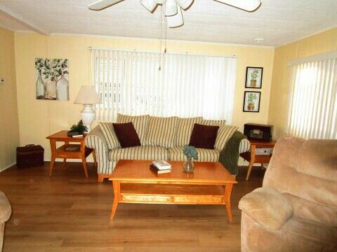 bow window, sofa, tables, recliner