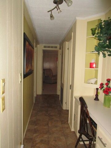 hall to indoor laundry, bedrooms, baths